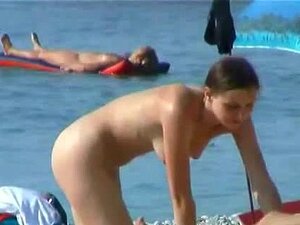 Cute blonde with pointy tits in this candid beach video