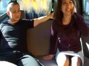 Japanese Milf Gives Handjob On Backseat Of Car